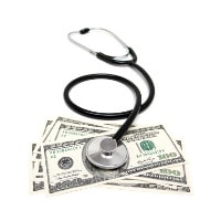 stethoscope-on-us-paper-currency-isolated-on-white-picture-id155440659-min